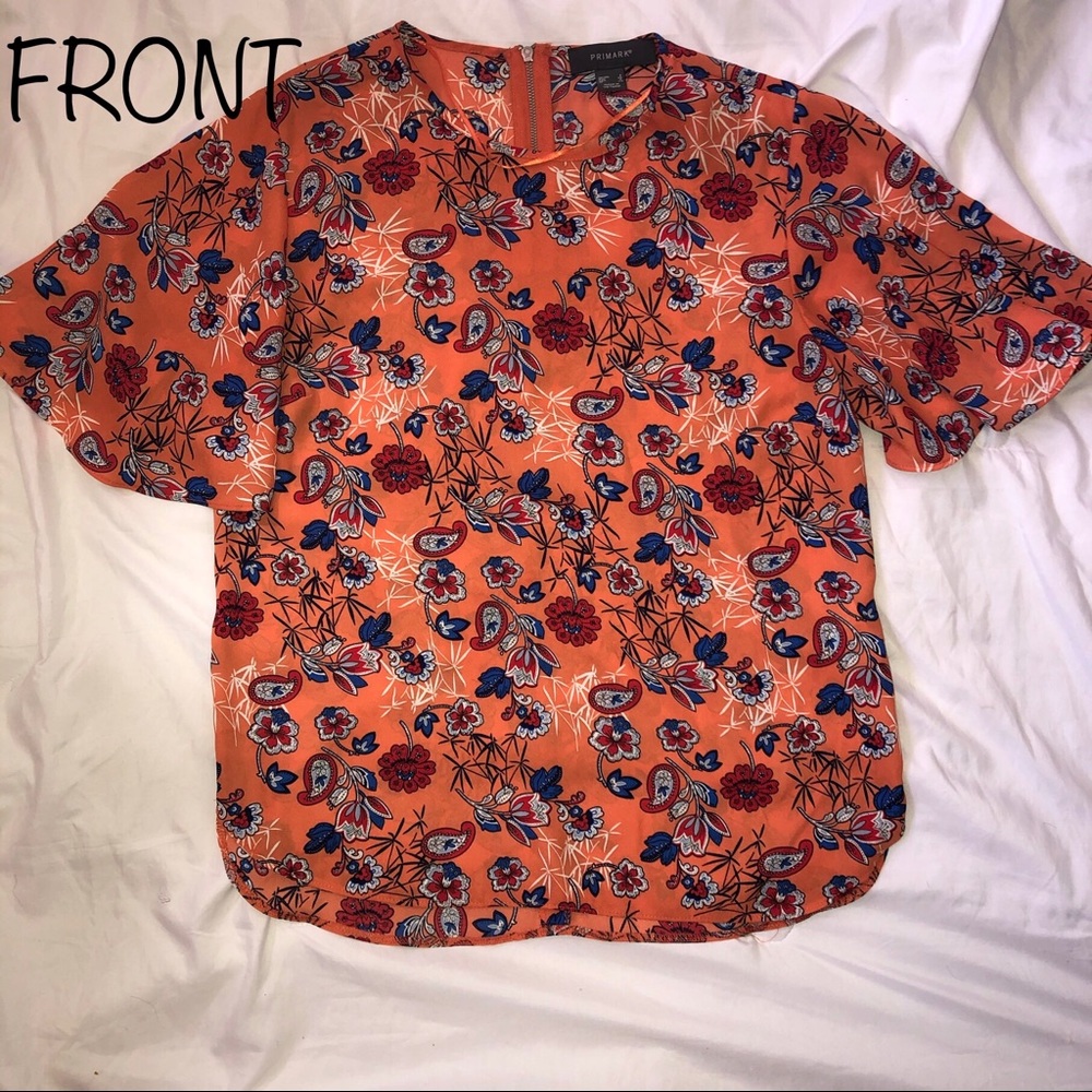 Orange shirt with floral design